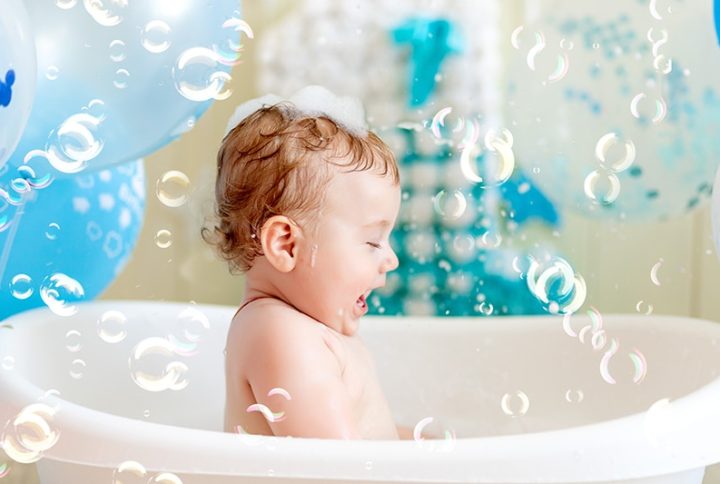 baby boy celebrates birthday 1 year bath with balloons bathing baby with blue balloons 1